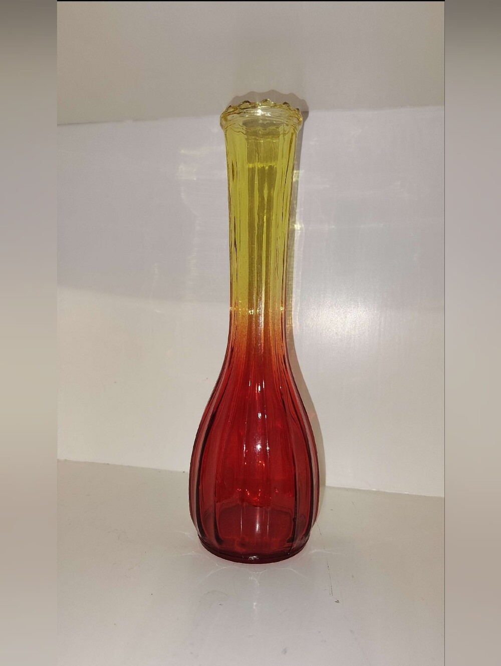 Amberina glass bud vase by Jeannette Glass Company
